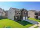 Exterior elevation showing a two-story home with well-manicured lawn and a two car garage at 6101 Providence Way, Union City, GA 30291