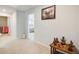 Hallway view with wall art, neutral carpet, and doorway to a bedroom at 6101 Providence Way, Union City, GA 30291