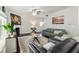 Cozy living room with fireplace, ceiling fan, and neutral color palette at 6101 Providence Way, Union City, GA 30291