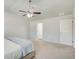 Bright bedroom featuring a ceiling fan and neutral walls and flooring at 6101 Providence Way, Union City, GA 30291