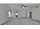 Spacious bedroom with plush carpeting, a ceiling fan, and walk in closet at 8103 White Oak Loop, Stone Mountain, GA 30038