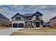 Beautiful two-story home with a brick and siding facade, two-car garage, and well-manicured lawn at 8103 White Oak Loop, Stone Mountain, GA 30038