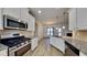 Modern kitchen with stainless steel appliances, granite countertops, white cabinetry, and a breakfast bar at 8103 White Oak Loop, Stone Mountain, GA 30038