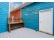 Outdoor deck featuring string lights, a wooden bench, and a white door to the home at 611 Irwin Ne St, Atlanta, GA 30312