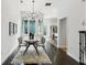 Inviting dining area with stylish chandelier and a view to the patio at 611 Irwin Ne St, Atlanta, GA 30312