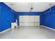 Clean, bright garage with blue walls and a grey epoxy floor at 611 Irwin Ne St, Atlanta, GA 30312