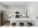 Modern kitchen features stainless steel appliances, a center island with stool seating, and ample cabinet space at 611 Irwin Ne St, Atlanta, GA 30312