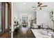 Open-concept living room with hardwood floors and a modern ceiling fan at 611 Irwin Ne St, Atlanta, GA 30312