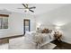Bright bedroom with large windows, door to balcony, plush bedding, creating a cozy and inviting retreat at 611 Irwin Ne St, Atlanta, GA 30312