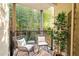 Cozy balcony with comfortable seating and a view of a bamboo forest at 975 Moda Dr, Atlanta, GA 30316