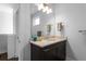 Half bathroom with stylish vanity, granite countertop, and modern fixtures at 975 Moda Dr, Atlanta, GA 30316