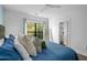 Bright bedroom with hardwood floors, large window, and ensuite bathroom entrance at 975 Moda Dr, Atlanta, GA 30316