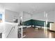 Bonus room with hardwood floors and space for a yoga mat and workout bench at 975 Moda Dr, Atlanta, GA 30316