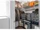 Well-organized closet with shelves and hanging storage for efficient space utilization at 975 Moda Dr, Atlanta, GA 30316