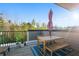 Outdoor wooden deck with umbrella, outdoor table and chairs offering a comfortable space to relax at 975 Moda Dr, Atlanta, GA 30316