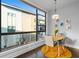 Bright dining area with a cozy table setting near a large window and modern decor at 975 Moda Dr, Atlanta, GA 30316