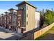 Modern townhome exterior with brick and siding, featuring clean lines and contemporary design at 975 Moda Dr, Atlanta, GA 30316