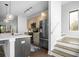 Contemporary kitchen with a kitchen island, stainless steel appliances, and hardwood flooring at 975 Moda Dr, Atlanta, GA 30316
