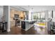 Modern kitchen with stainless steel appliances, an island with bar seating, and a large window at 975 Moda Dr, Atlanta, GA 30316