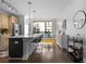 Bright kitchen with a view, stainless steel appliances, quartz countertops, and sleek modern lighting at 975 Moda Dr, Atlanta, GA 30316