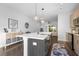 Spacious kitchen with bar seating, quartz countertops and stainless steel appliances at 975 Moda Dr, Atlanta, GA 30316