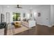 Bright living room featuring a comfortable sofa, ceiling fan and hardwood flooring at 975 Moda Dr, Atlanta, GA 30316