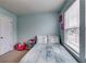 Brightly painted bedroom with a comfortable bed, cheerful decor, and natural light streaming through the window at 1155 Magnolia Gardens Walk, Mcdonough, GA 30253