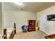 Bedroom features a wooden bed frame, colorful decor, and natural light from a window, creating a cozy atmosphere at 1155 Magnolia Gardens Walk, Mcdonough, GA 30253