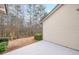 View of the back patio surrounded by trees and green space, providing a relaxing outdoor space at 3916 Abbott Way # 2, Powder Springs, GA 30127
