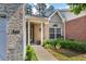 Close-up of the home's address sign and front entrance, surrounded by lush greenery and manicured landscaping at 3916 Abbott Way # 2, Powder Springs, GA 30127