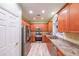 Well-equipped kitchen featuring stainless steel appliances and warm wood cabinetry at 3916 Abbott Way # 2, Powder Springs, GA 30127