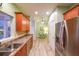 Bright kitchen featuring wood cabinets, stainless steel appliances, and a view to a breakfast nook at 3916 Abbott Way # 2, Powder Springs, GA 30127