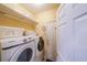 Well-organized laundry room with modern front-load washer and dryer and ample shelving at 3916 Abbott Way # 2, Powder Springs, GA 30127