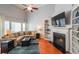 Comfortable living room with a fireplace, built-in shelving, and a large window at 3916 Abbott Way # 2, Powder Springs, GA 30127