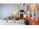 Cozy living room featuring a fireplace with built-in bookshelves and hardwood floors at 3916 Abbott Way # 2, Powder Springs, GA 30127