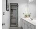 Bright bathroom with black and white tile and a shower with a glass door at 893 Brownwood Avenue Se Ave, Atlanta, GA 30316