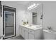 Bathroom featuring black and white tile, white cabinets, and a large mirror at 893 Brownwood Avenue Se Ave, Atlanta, GA 30316