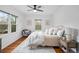 Charming bedroom boasts hardwood floors, a ceiling fan, and sunny windows at 893 Brownwood Avenue Se Ave, Atlanta, GA 30316