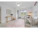 Bright Bedroom features a window, crib, side table, area rug and decorative ladder at 893 Brownwood Avenue Se Ave, Atlanta, GA 30316