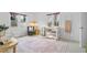 Bright bedroom with two windows, a crib, area rug, side table and decorative ladder at 893 Brownwood Avenue Se Ave, Atlanta, GA 30316