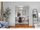 Cozy dining area with hardwood floors, modern lighting, and seating for four, adjacent to the living room at 893 Brownwood Avenue Se Ave, Atlanta, GA 30316