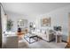 Bright living room with hardwood floors, neutral decor, and an open view to the dining area at 893 Brownwood Avenue Se Ave, Atlanta, GA 30316