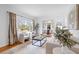 Bright living room featuring hardwood floors, neutral decor, and an open view to the dining area at 893 Brownwood Avenue Se Ave, Atlanta, GA 30316