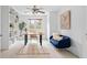 Bright study features built-in shelves, a modern desk and a comfortable blue sofa for relaxing at 893 Brownwood Avenue Se Ave, Atlanta, GA 30316