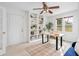 Bright office space with white walls, built in shelving, modern desk, and large window at 893 Brownwood Avenue Se Ave, Atlanta, GA 30316