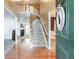 A home foyer with wood floors and stairs at 995 Brighton Cove Trl, Lawrenceville, GA 30043