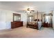 Spacious main bedroom with a four-poster bed, dresser, and windows providing plenty of natural light at 995 Brighton Cove Trl, Lawrenceville, GA 30043