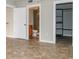 Bedroom featuring tile floors, doors to the bathroom and walk-in closet at 1280 W Peachtree Nw St # 3709, Atlanta, GA 30309