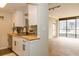 Modern kitchen features white cabinets, stainless steel appliances, and wood countertops at 1280 W Peachtree Nw St # 3709, Atlanta, GA 30309