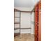 Spacious walk-in closet with wooden shelving and clothing rods at 1280 W Peachtree Nw St # 3709, Atlanta, GA 30309